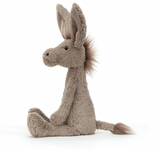 A soft gray fabric donkey toy with a spiky mane and long flappy ears, sitting upright.