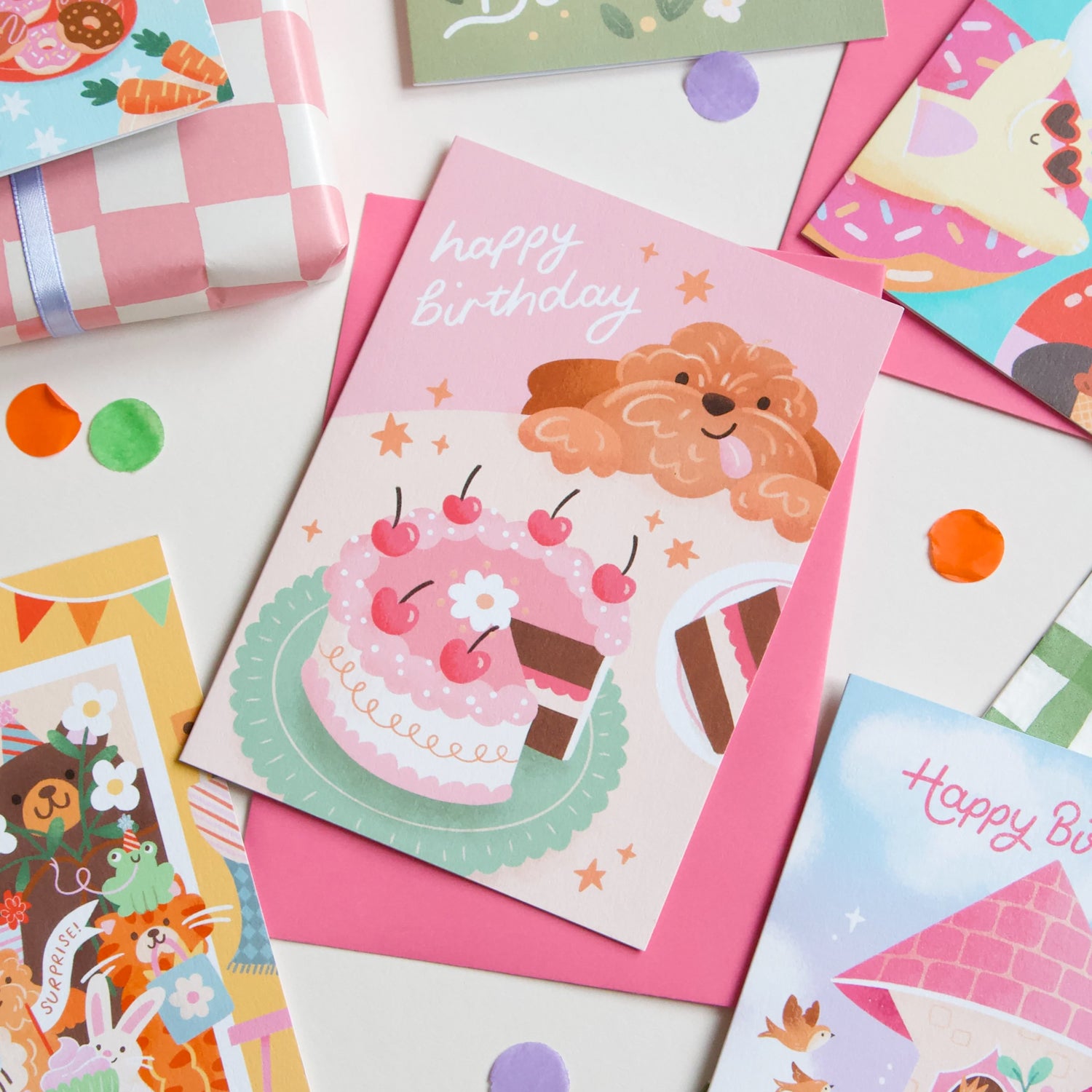 Collection of colorful greeting cards with various designs on a white background