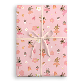 Gift wrap with bunny and flower pattern on a pink background