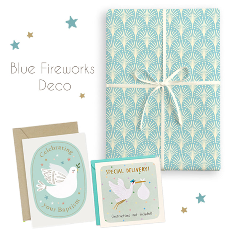 Packaging with blue fireworks design, cards, and envelopes on a white background