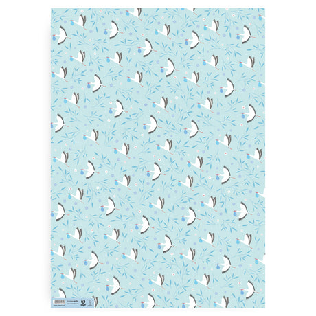 A Patterned blue gift wrap paper sheet with white storks holding a blue bundle  and blie leaves with purple flowers