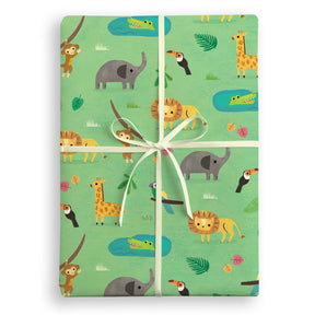 Gift box wrapped with jungle-themed paper featuring animals on a white background