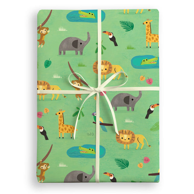 Gift box wrapped with jungle-themed paper featuring animals on a white background