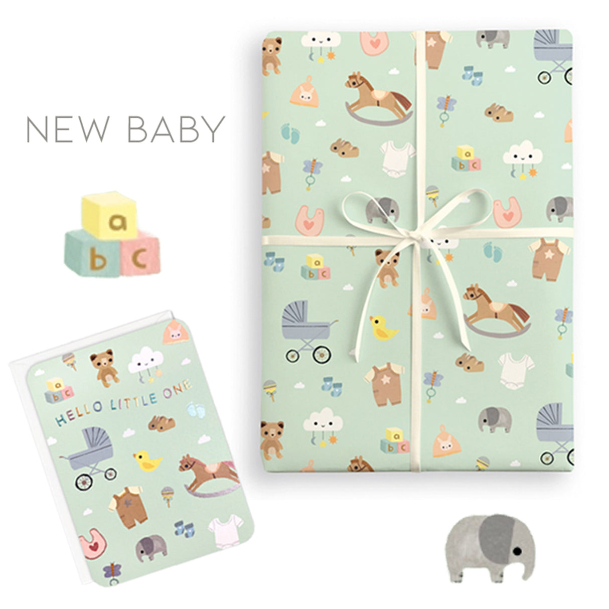 Gift wrap with baby-themed design and matching card on a white background