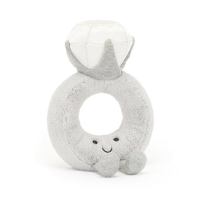 Jellycat Plush dimond ring shaped toy with a face on a white background