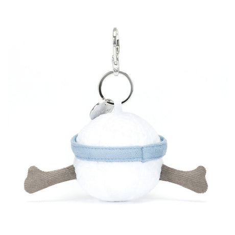 Plush Jellycat golf ball keychain with a blue sun hat and brown arms on a white background