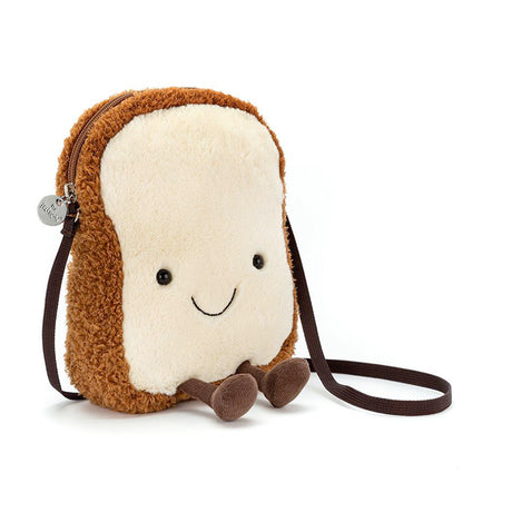 A plush toy resembling a slice of toast with a smiling face, complete with a cross-body strap.