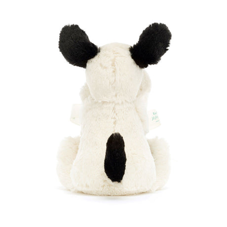 White plush toy with black accents on a white background