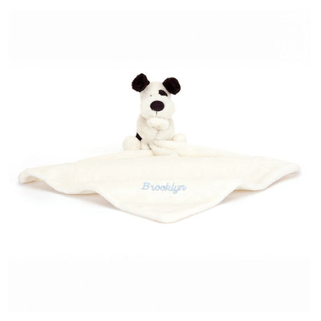 White plush toy with black spots on a white blanket, featuring the name 'Brooklyn'.