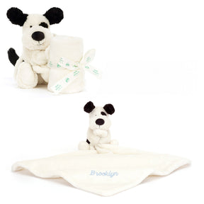 Two plush baby dog soother toys with black ears and black noses on white backgrounds
