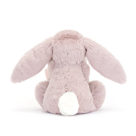 Pink plush bunny toy on a white background