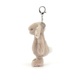 Plush bunny keychain with a tag on a white background