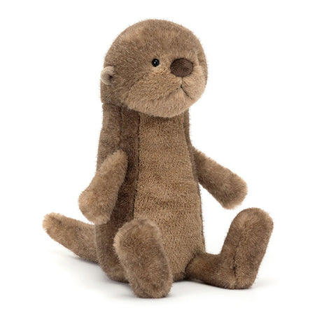 A plush toy depicting a brown otter with a soft, mottled fudge fur texture, butterscotch ears, a black nose, and bright black eyes. It is seated with a long, chunky tail extended.