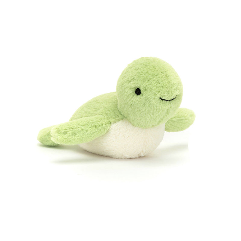 Green plush turtle toy on a white background