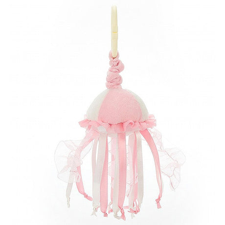 A pink Jellycat sea streamer jellyfish jitter with frilled tentacles, complete with a yellow ring for attachment.