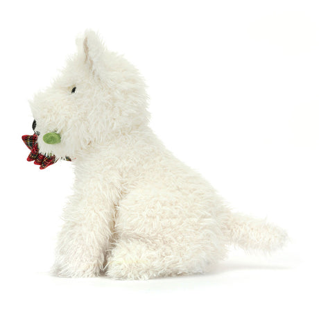 A plush toy depicting a white-coloured dog with a black suedette nose, holding a red tartan rose in its mouth.