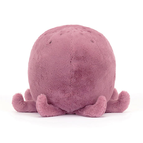 Pink plush octopus toy on a white background