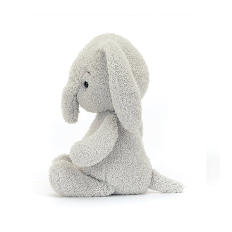 A gray plush toy resembling a baby elephant with short, floppy ears and a soft, chunky head.