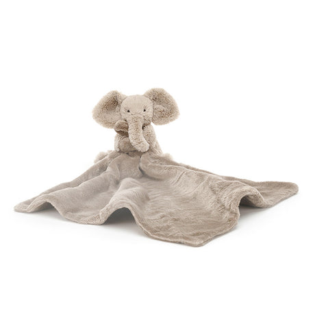 Plush elephant toy with a blanket on a white background