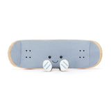 A plush toy in the shape of a skateboard with a smiling face. It has blue fabric with beige edging and orange details.