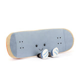 A plush toy in the shape of a skateboard with a smiling face. It has blue fabric with beige edging and orange details.