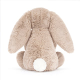 A beige plush toy rabbit sitting upright 