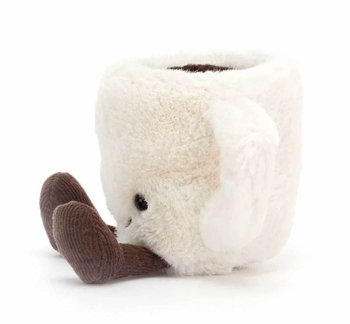 A plush toy designed to look like an espresso cup with a smiling face and chocolatey cordy feet.