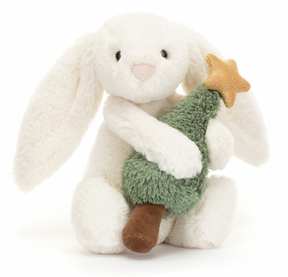 White Bunny holding a Christmas Tree with a gold star