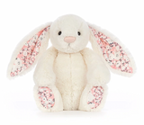 white Soft bunny toy with pink cherry blossom fabric patterned ears and feet 