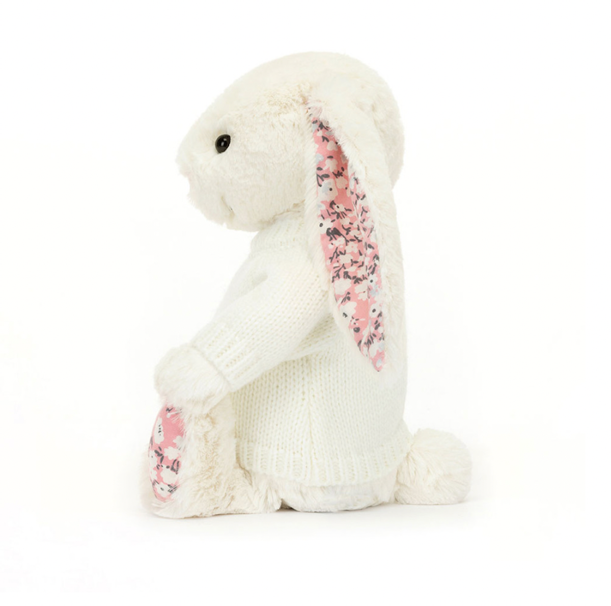 white Soft bunny toy with pink cherry blossom fabric patterned ears and feet wearing a knitted jumper