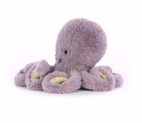 A plush toy resembling a mauve octopus with embroidered features and soft texture.
