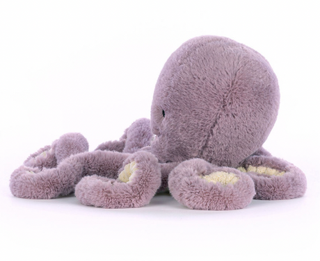 A plush toy resembling an octopus with a smiling face, made of soft purple fabric,