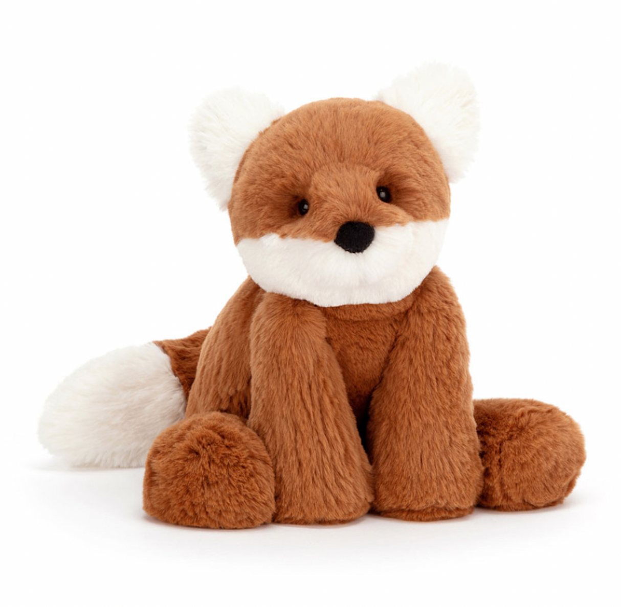 A plush toy representing a dark orange fox with fluffy cream ears and a tail, Sitting down on a plain background.