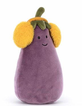 A plush toy resembling an aubergine with a smiling face, wearing yellow earmuffs, and a soft purple body.