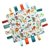 A handmade baby taggy comforter with jungle animal print, backed with plush fabric, and decorated with double-sided satin ribbon tags in various colours.