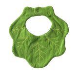 Reverse side of green baby bib with kale leaf patterns on a white background