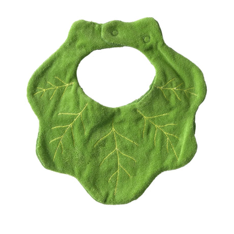 Reverse side of green baby bib with kale leaf patterns on a white background