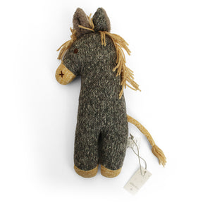 A handmade woolly horse plush toy in a dark gray and brown marled fabric, featuring a tan textured mane, a stitched brown nose, and a tan tail