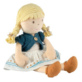Plush doll with blonde hair, blue cardigan, and white dress on a white background