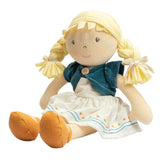 Soft rag doll with blonde hair, blue cardigan, and white dress on a white background