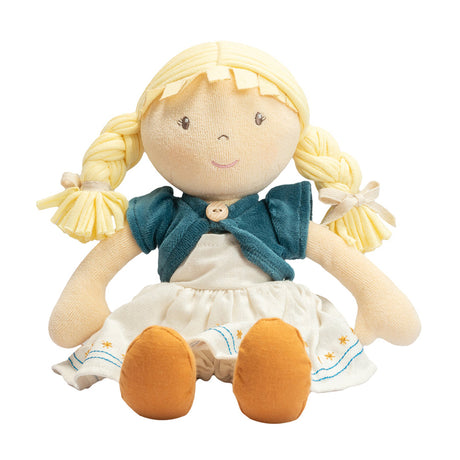 Soft rag doll with blonde hair, blue sweater, and white dress on a white background