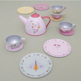 Children's tea set with pink teapot, cups, and saucers on a light gray surface.