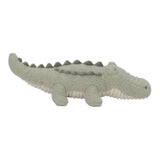 A plush crocodile toy in a textured sage green fabric with a cream underside, shown against a plain white background.