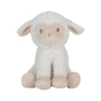White plush lamb toy with pink accents on a white background