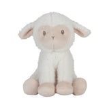 White plush lamb toy with pink accents on a white background