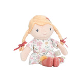 Plush mini toy doll with blonde hair and floral dress on a white background
