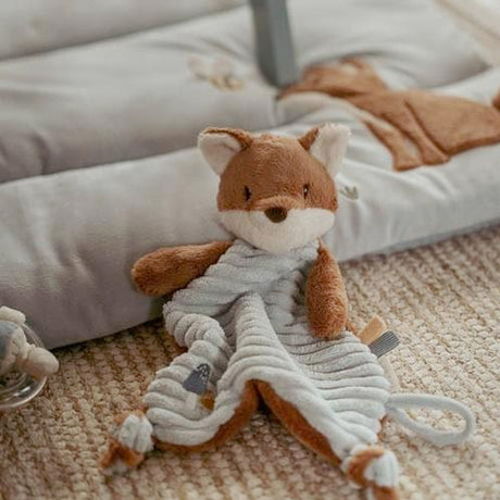 Little Dutch Plush fox cuddle cloth toy with a dummy clip on a carpeted floor