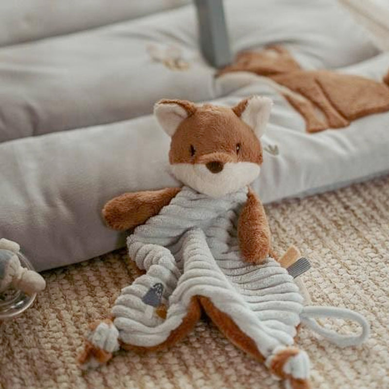 Little Dutch Plush fox cuddle cloth toy with a dummy clip on a carpeted floor