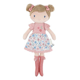 Little Dutch Hug Doll Rosa standing upright, with brown bun hairstyle, pink bows, embroidered floral T-shirt, floral skirt and pink pompom boots, on a white background