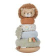 A plush lion baby toy with a soft brown mane, cream face, and patterned fabric body, stacked on a wooden base with textured fabric layers and small sensory tabs, photographed on a white background.
